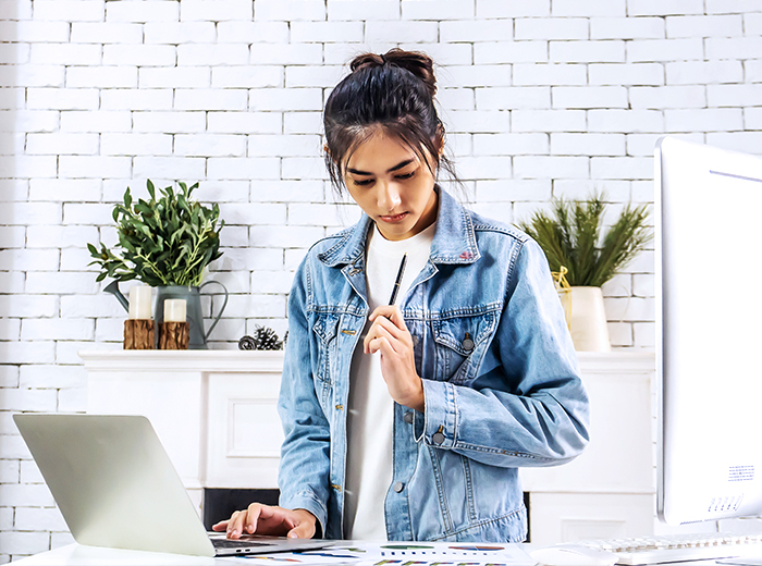 Image Woman Jean Jacket at Computer